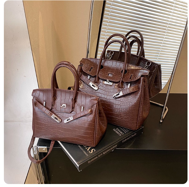 Retro-chic stone-patterned Kelly bag, 2025 winter new style, niche trendy fashion shoulder bag, versatile women's bag.