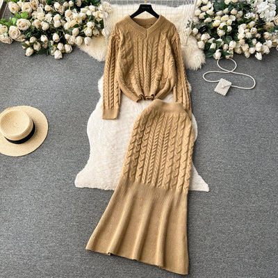 Slightly fat and slimming suit, cold style women's Hong Kong style retro twist long-sleeved top + fishtail skirt two-piece set