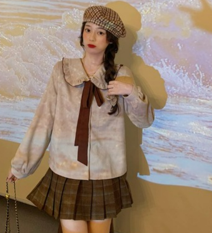 Autumn 2021 new style Korean fashion western style suit female sweet age reduction loose shirt sweater + plaid skirt